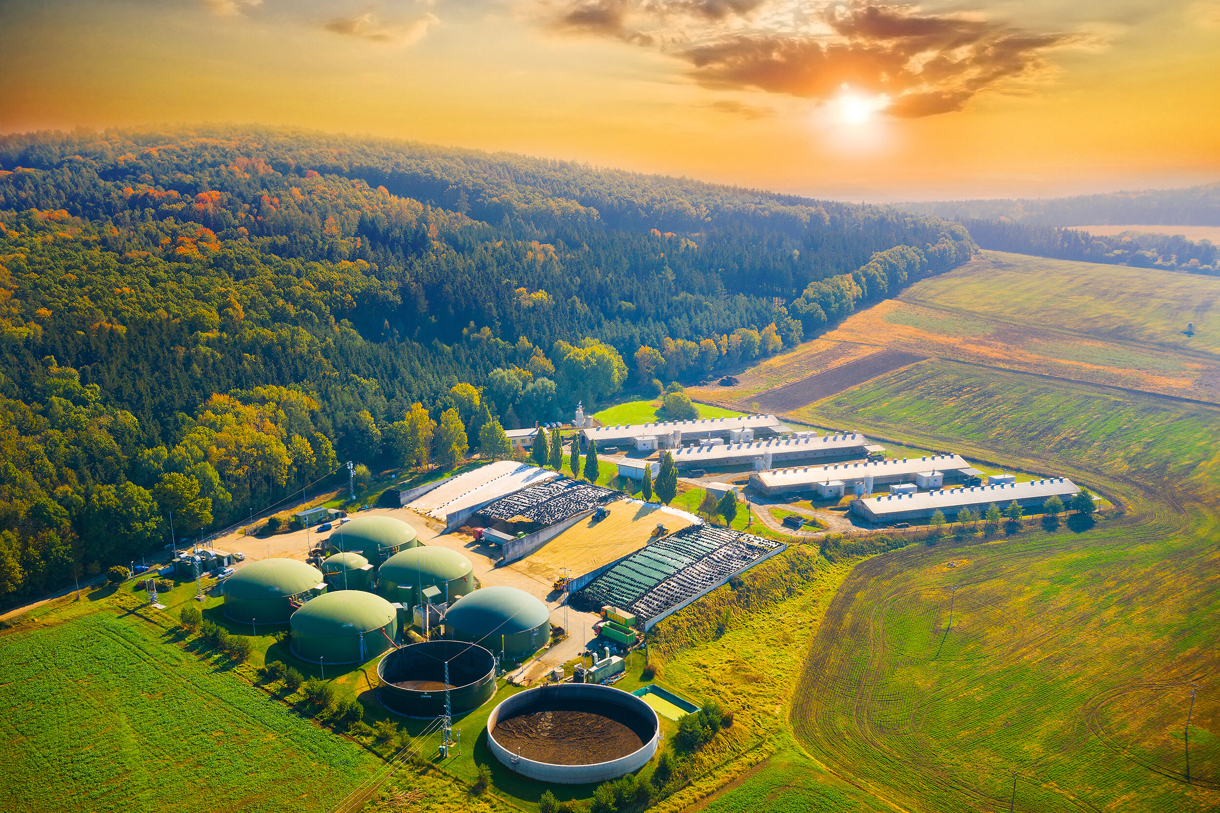 Biogas plant in agricultural landscape.