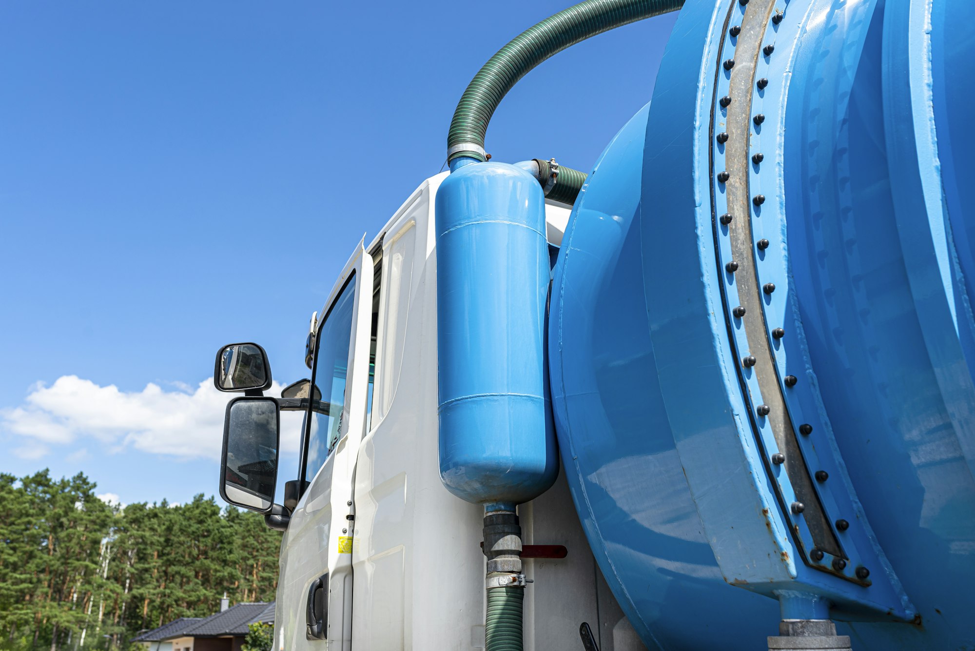 A truck with a large tank for pumping out a septic tank with a capacity of more than 20 cubic meters