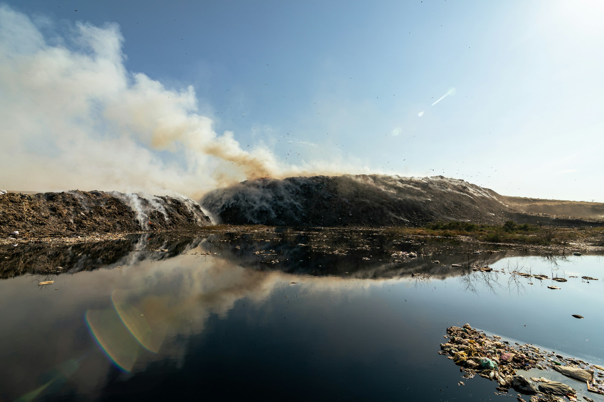 Landfill with burning trash piles