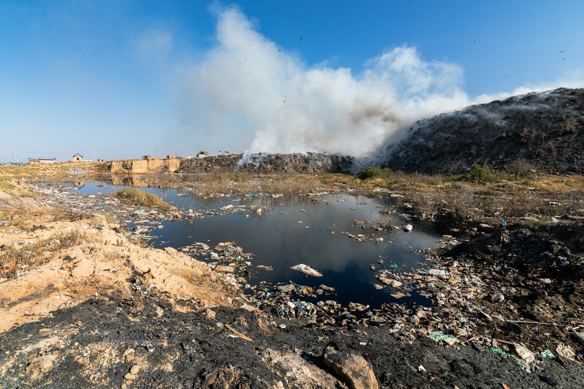 Landfill leachate with burning trash piles