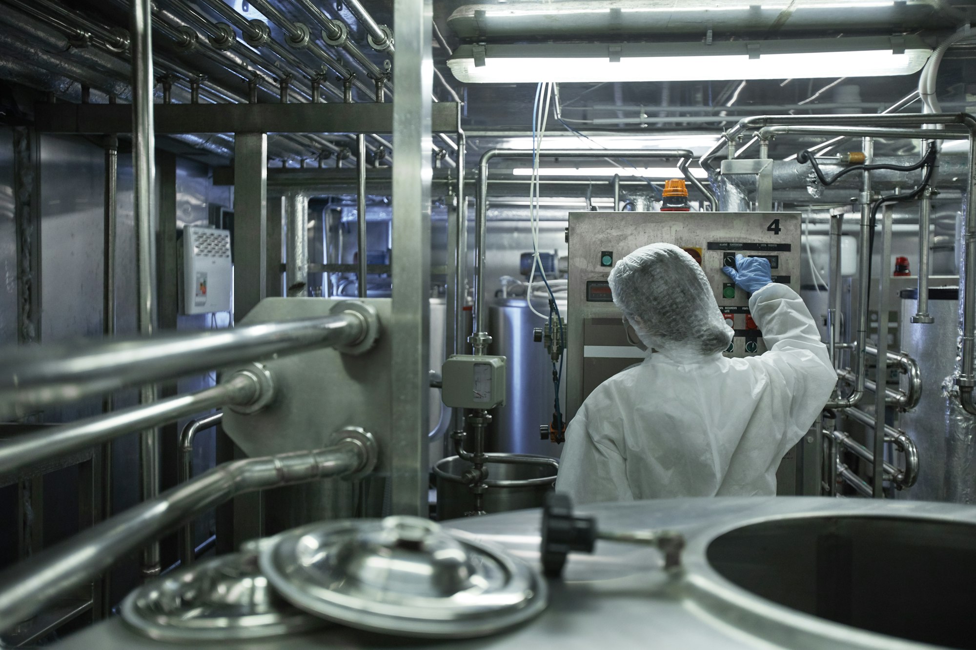 Worker Controlling Production at Factory