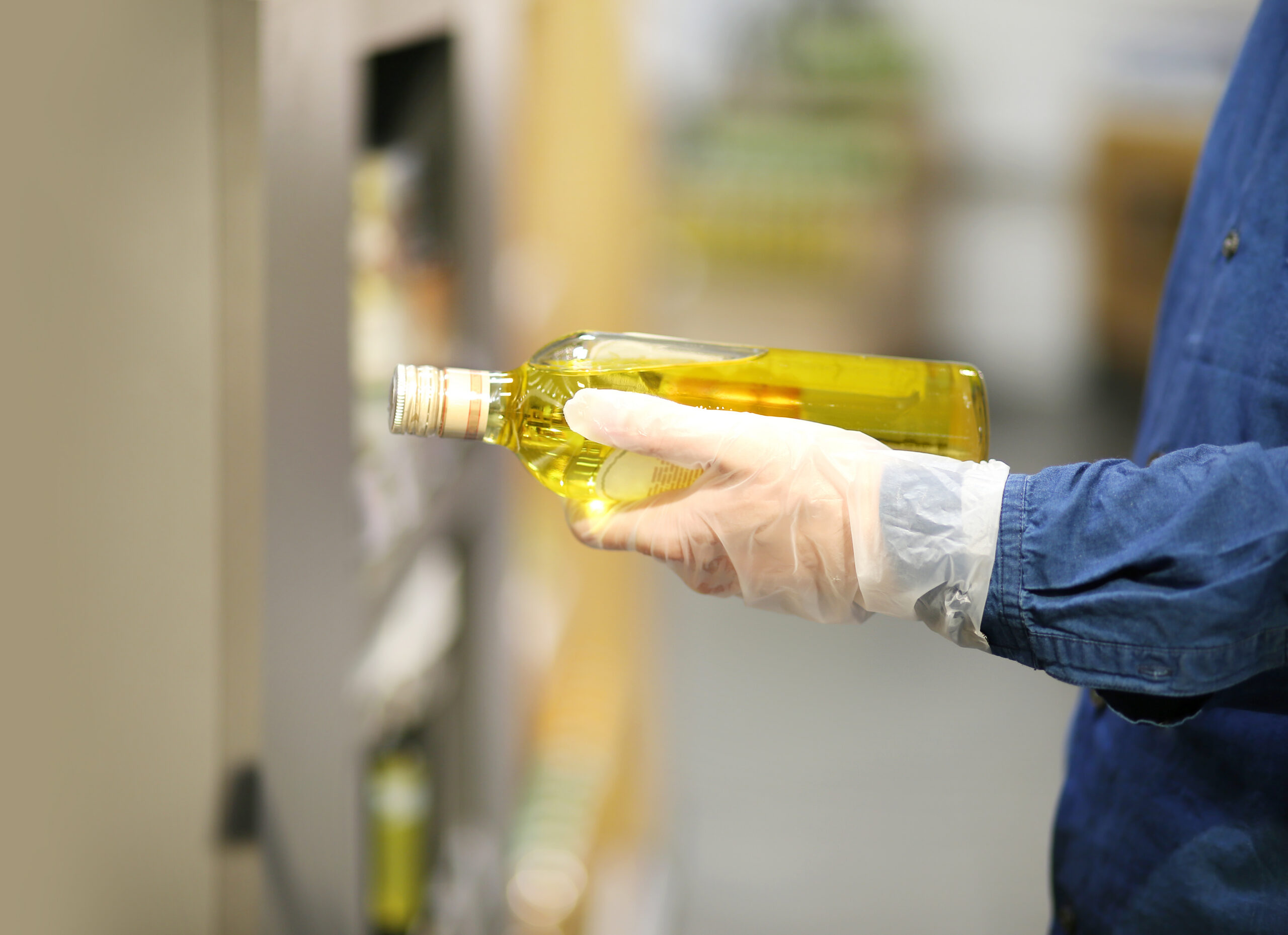 Olive Oil's Wastewater Deadline Is Already Here alpechin gloved-hand-holds-bottle-of-olive-oil-2026-09-25-02-52-45-utc