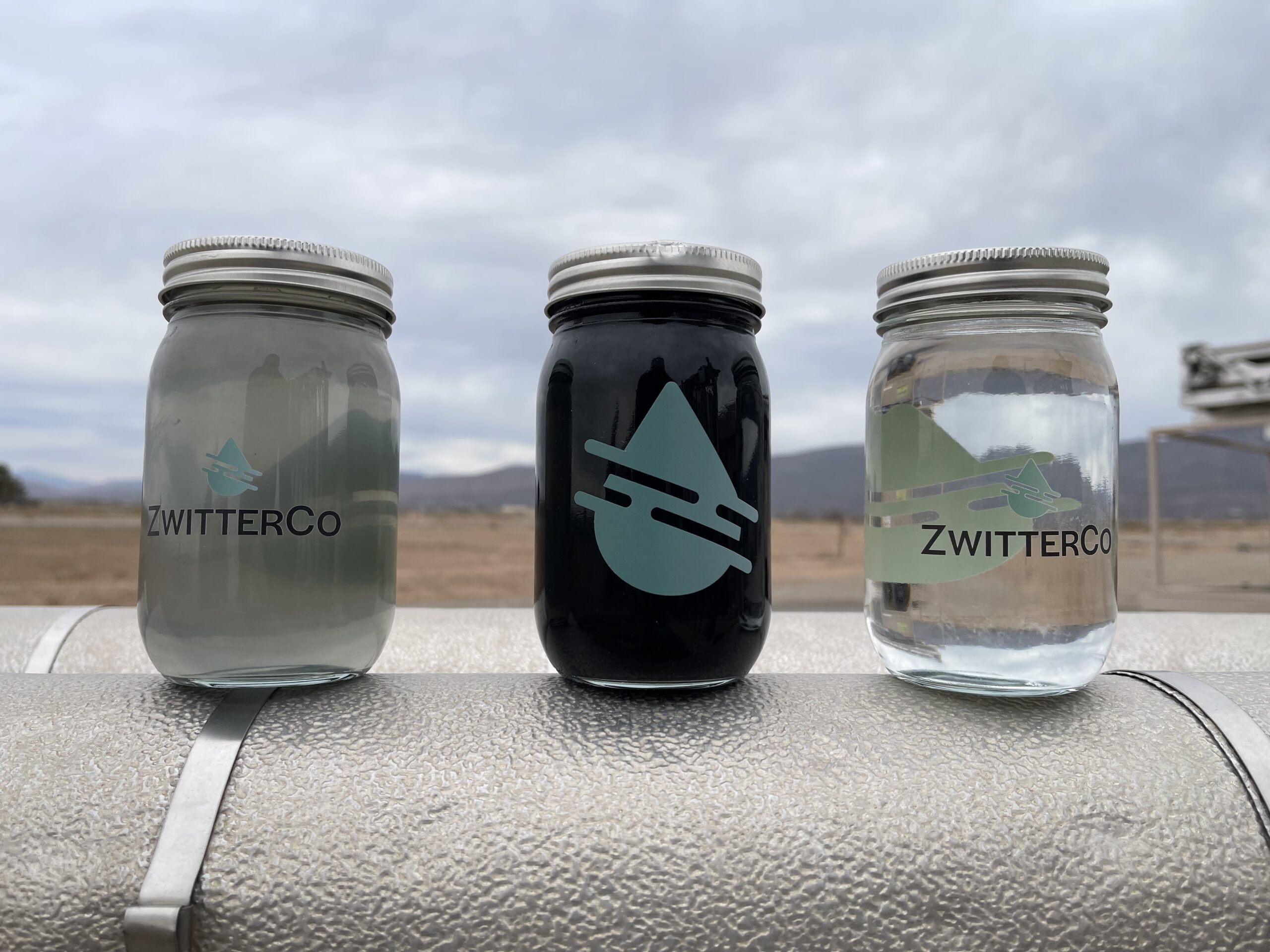 three jars showing produced water treated by ZwitterCo superfiltration membranes